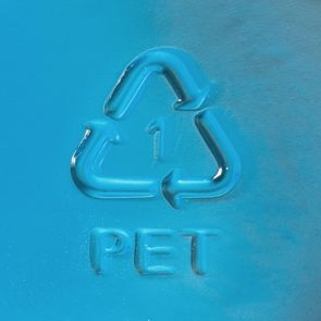 Blue surface shows embossed recycling symbol with arrows surrounding a number 