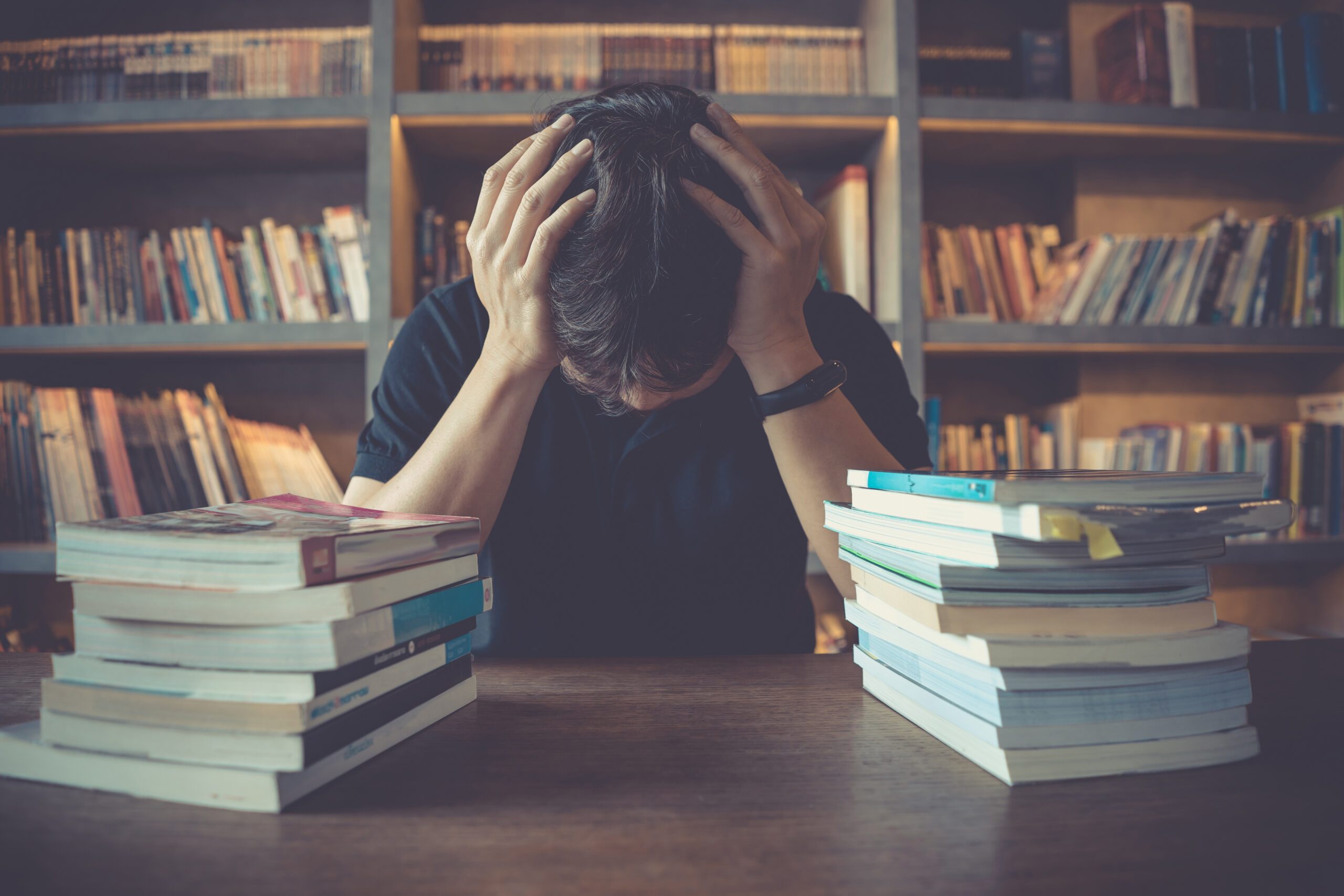 Stress,and,tired,man,under,mental,pressure,while,reading,book