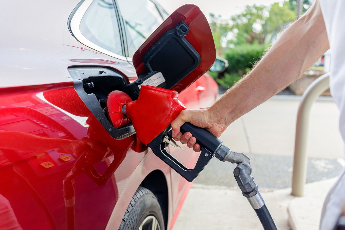 Man Refueling His Car At Gas Station