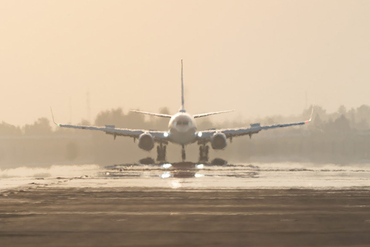 Aircraft ready for takeoff on a scorching day, plane lined up for departure in extreme heat